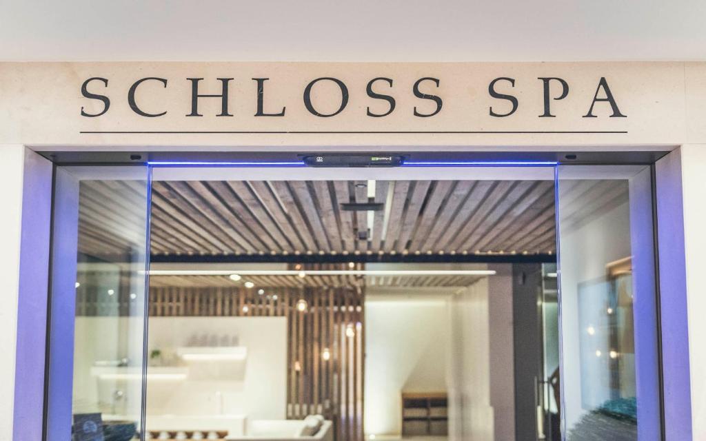 a store front of a store with a glass door at Schlosshotel Ischgl 5-Sterne Superior in Ischgl