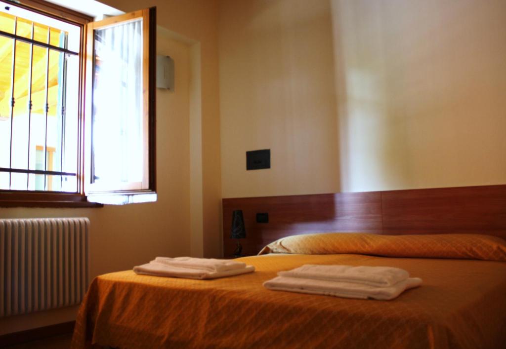 Postel nebo postele na pokoji v ubytování Bed&Wine