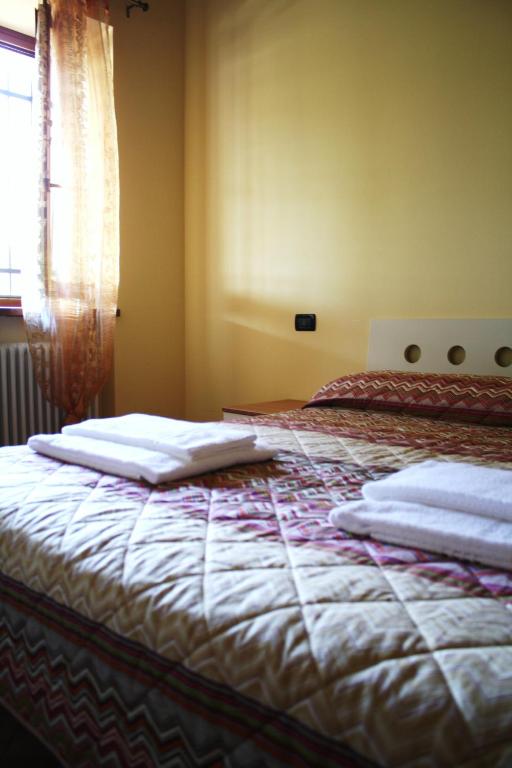 Postel nebo postele na pokoji v ubytování Bed&Wine