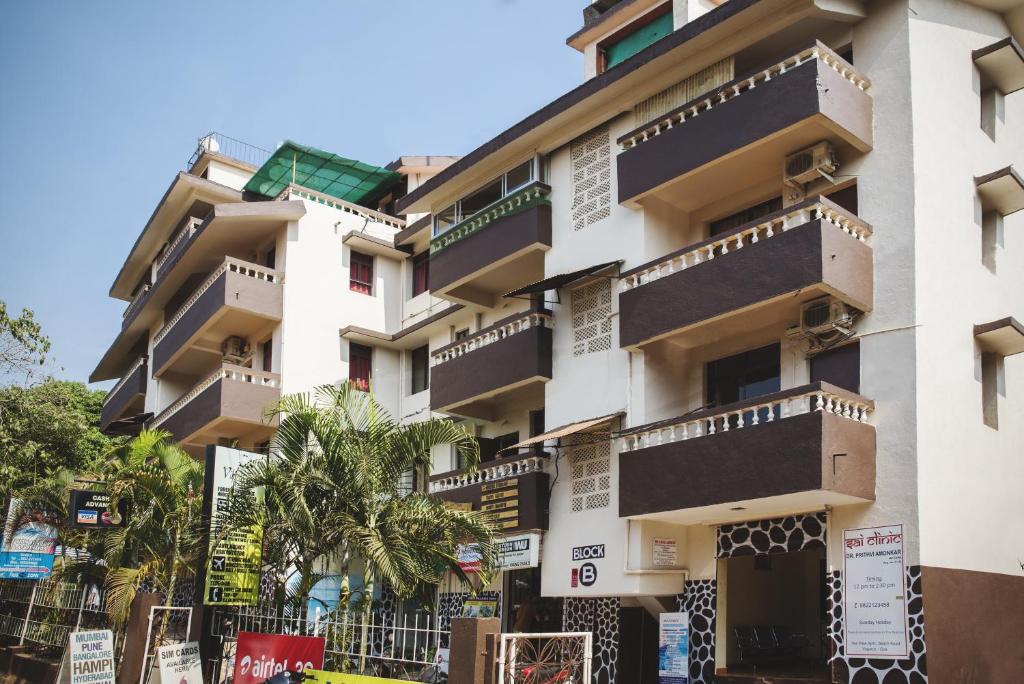 a building with balconies on the side of it at Sea View Holiday Vagator in Vagator