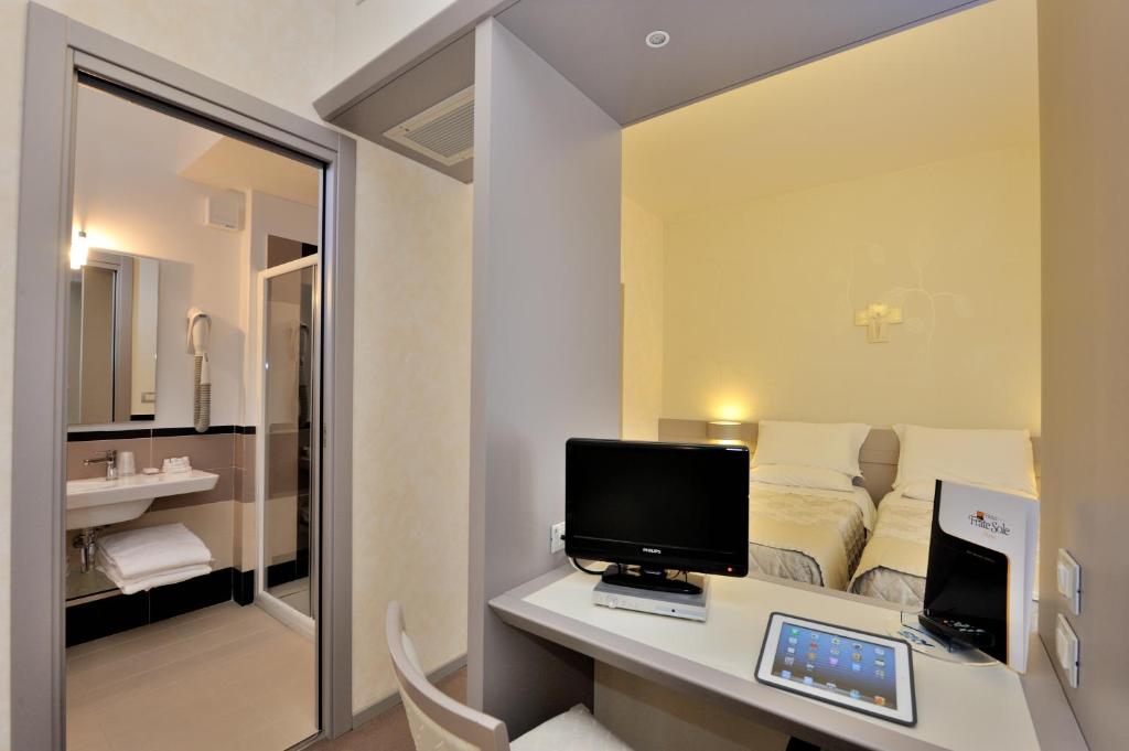 TV a/nebo společenská místnost v ubytování Hotel Frate Sole