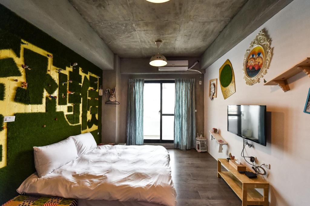 Krevet ili kreveti u jedinici u okviru objekta Anping Wikid Design Hotel