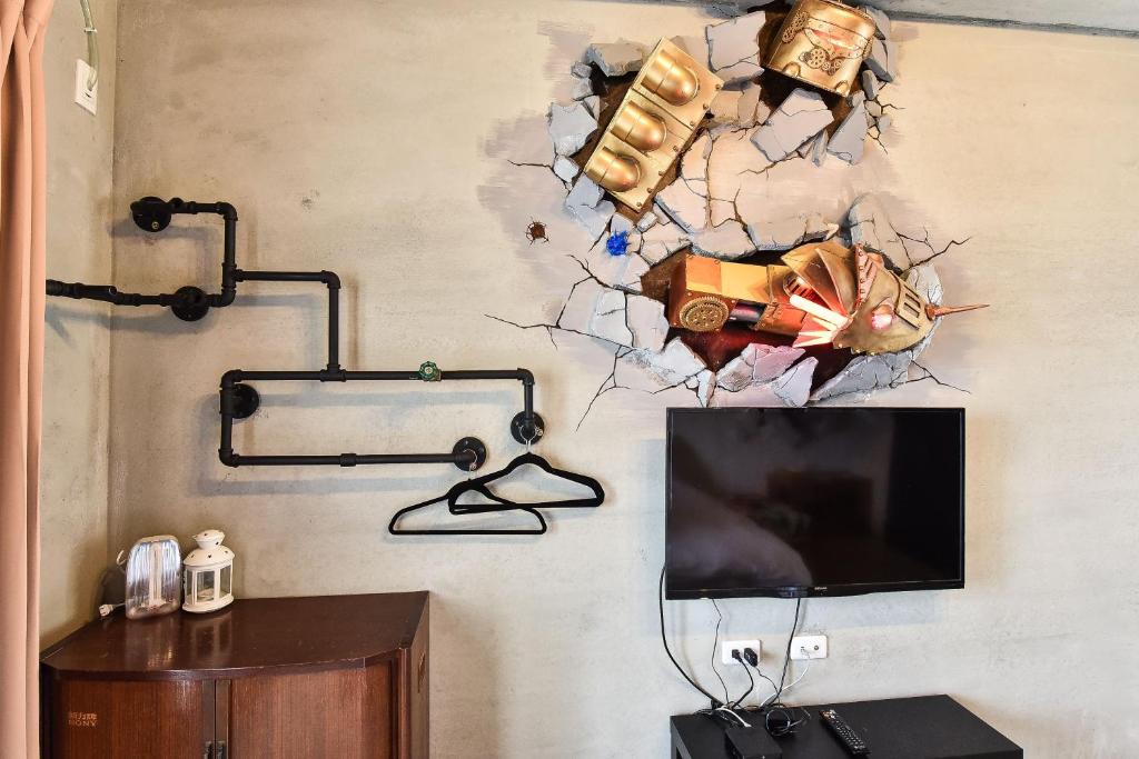 TV i/ili multimedijalni sistem u objektu Anping Wikid Design Hotel