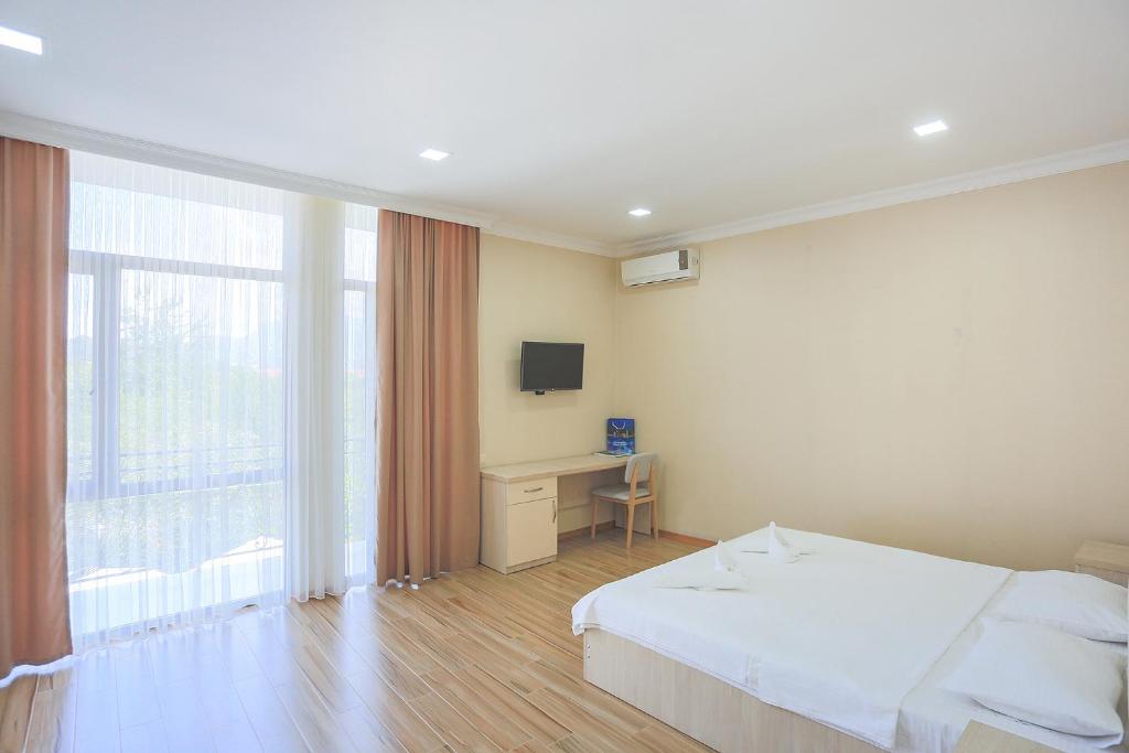 TV a/nebo společenská místnost v ubytování Hotel Botanica