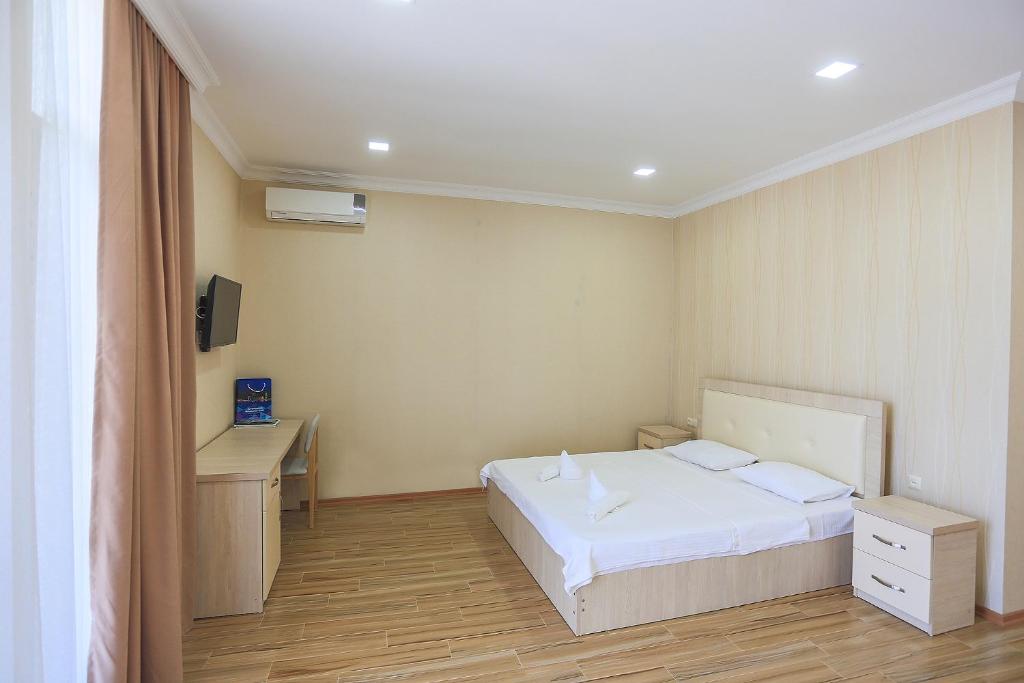 Postel nebo postele na pokoji v ubytování Hotel Botanica
