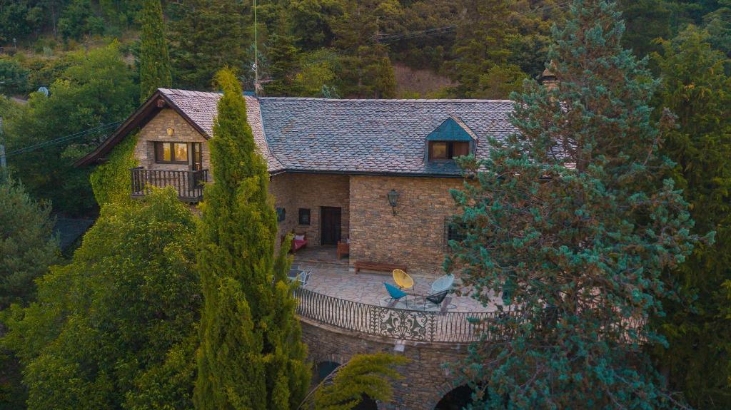 an aerial view of a house in the woods at Borda del Vinyer in Sort