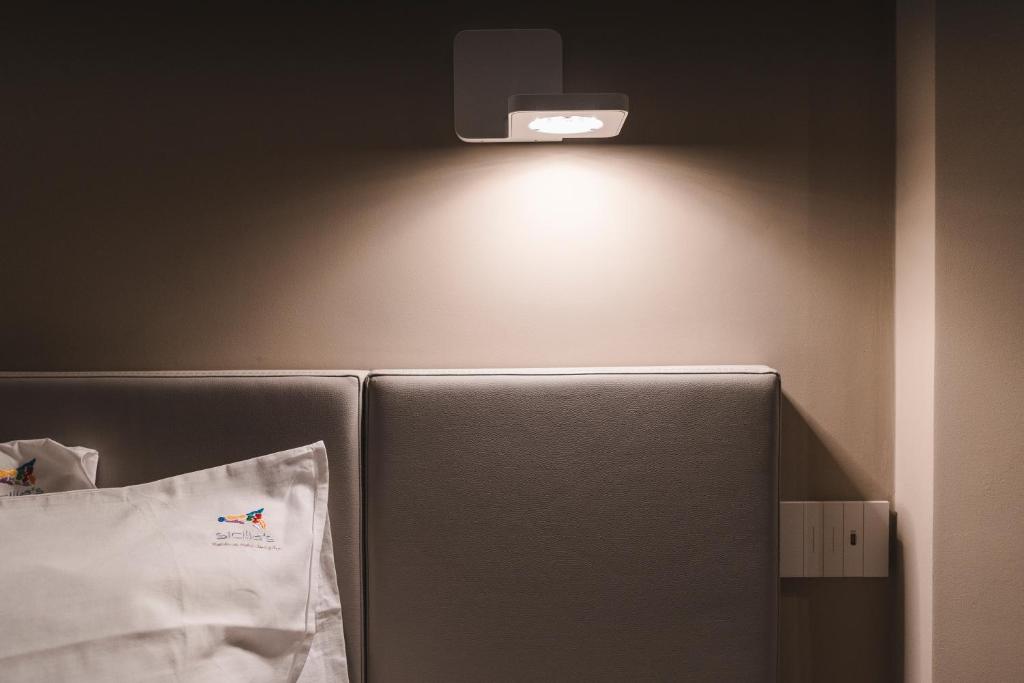 a refrigerator with a light on top of it at Sicilia's Art Hotel & Spa in Acitrezza