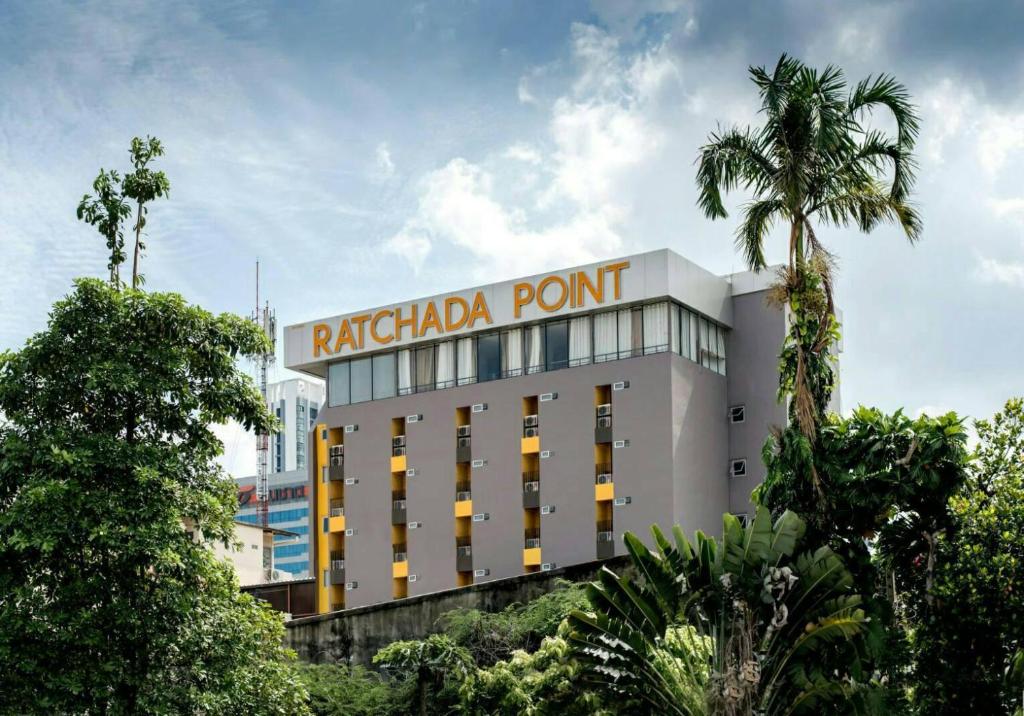 a building with a sign that reads raleigh point at Ratchada Point Hotel in Bangkok