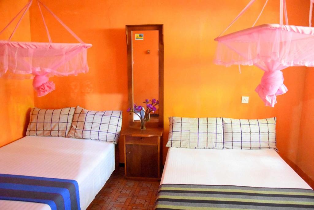 Postel nebo postele na pokoji v ubytování S P City Resort