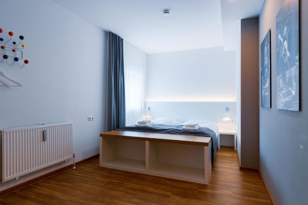 Postel nebo postele na pokoji v ubytování mk hotel münchen max-weber-platz