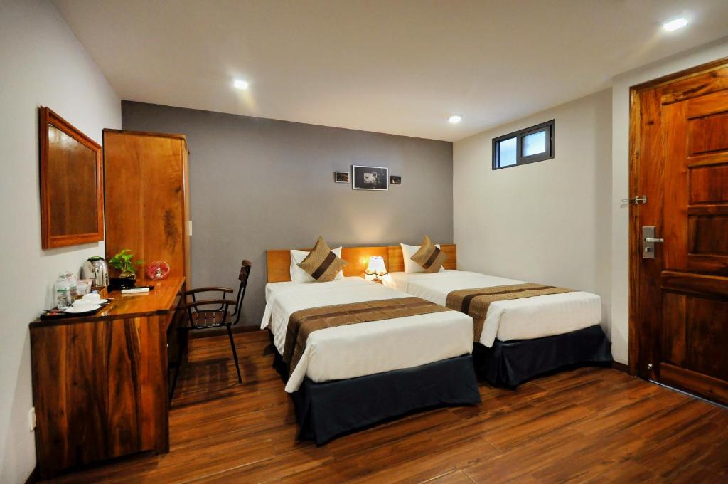 Ένα ή περισσότερα κρεβάτια σε δωμάτιο στο CKD Nha Trang hotel