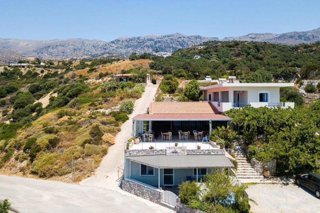 an aerial view of a house on a hill at Voukelari Rooms in Plakias