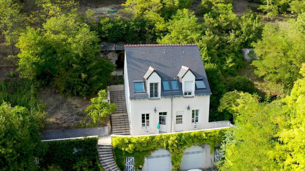 an overhead view of a white house in the woods at La Roche Bellevue in Luynes