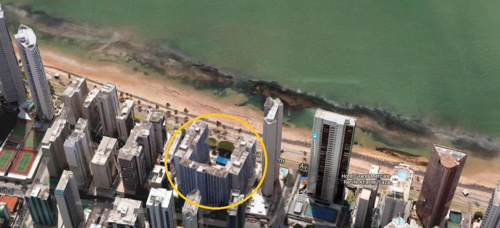 an aerial view of a city with a yellow circle at Kitinete Avenida Boa Viagem in Recife