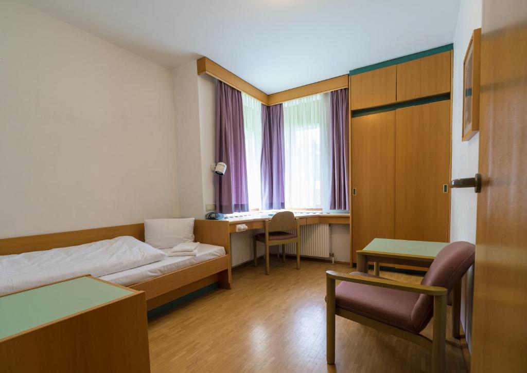 Postel nebo postele na pokoji v ubytování Schloss Puchberg
