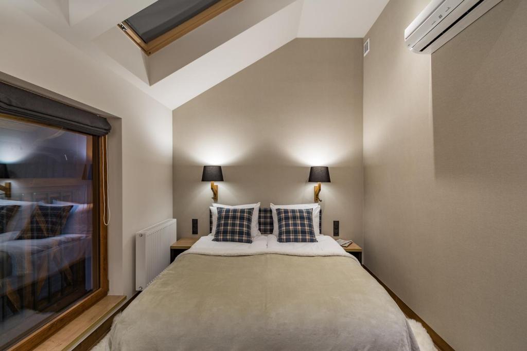 Ein Bett oder Betten in einem Zimmer der Unterkunft Szczawnica Park Resort & Spa