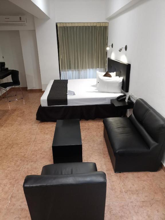 Postel nebo postele na pokoji v ubytování Hotel Maya Yucatan