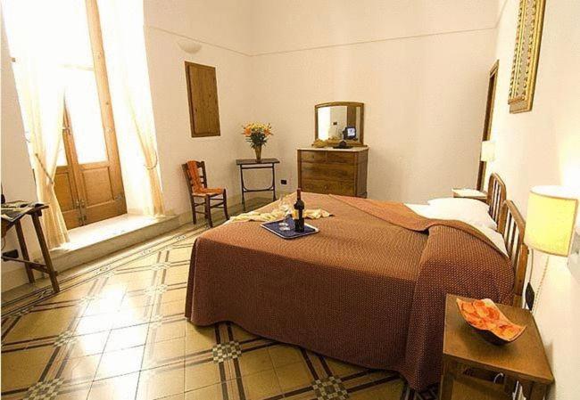 Postel nebo postele na pokoji v ubytování Hotel Palazzo D'Erchia