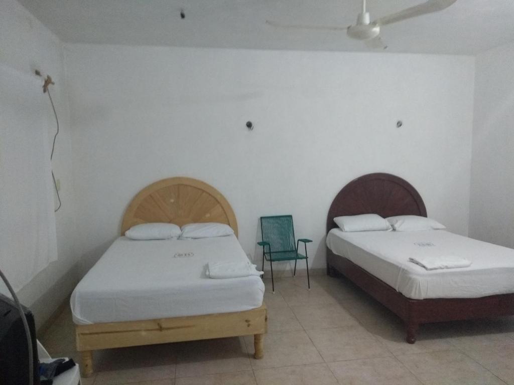 Postel nebo postele na pokoji v ubytování Hospedaje Papagrande