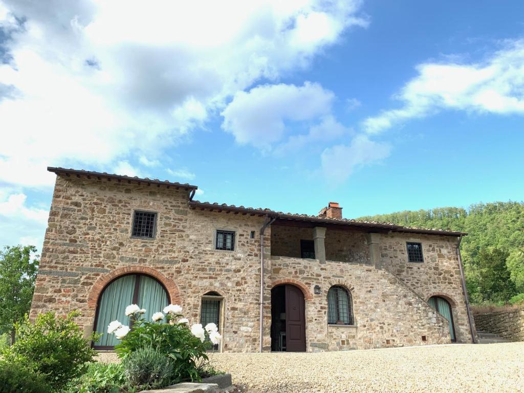 a large stone building with a sky at Villa Pie Vecchia in Greve in Chianti