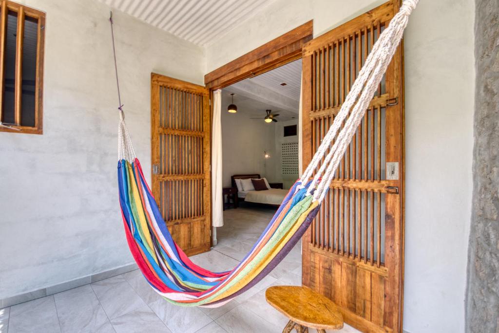 Postel nebo postele na pokoji v ubytování Omega Tours Eco-Jungle Lodge