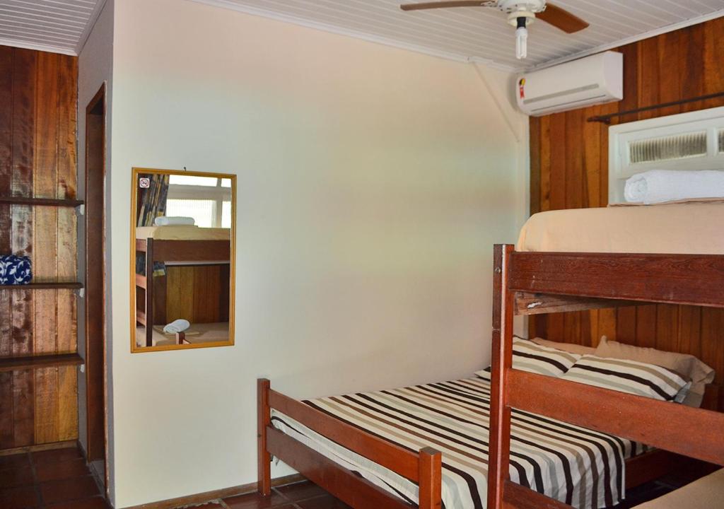 Cama ou camas em um quarto em Pousada Renascer