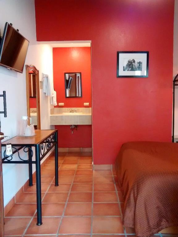 Postel nebo postele na pokoji v ubytování Hotel Casa Margarita