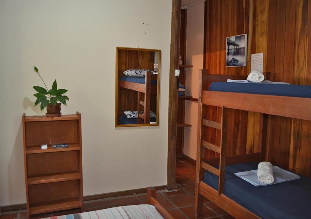 Cama ou camas em um quarto em Pousada Renascer
