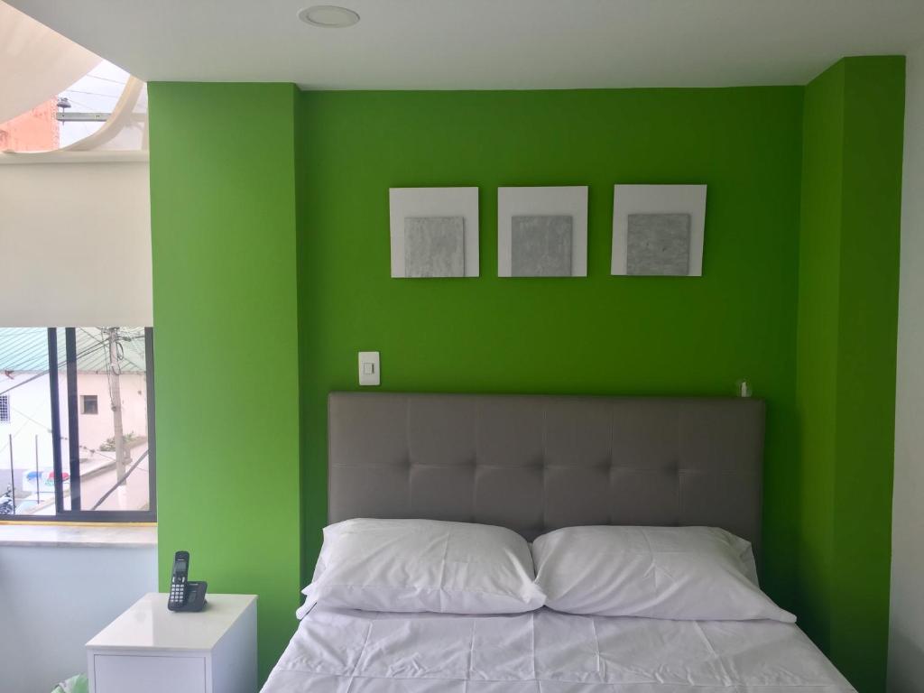 Postel nebo postele na pokoji v ubytování Hotel Garden City Boutique