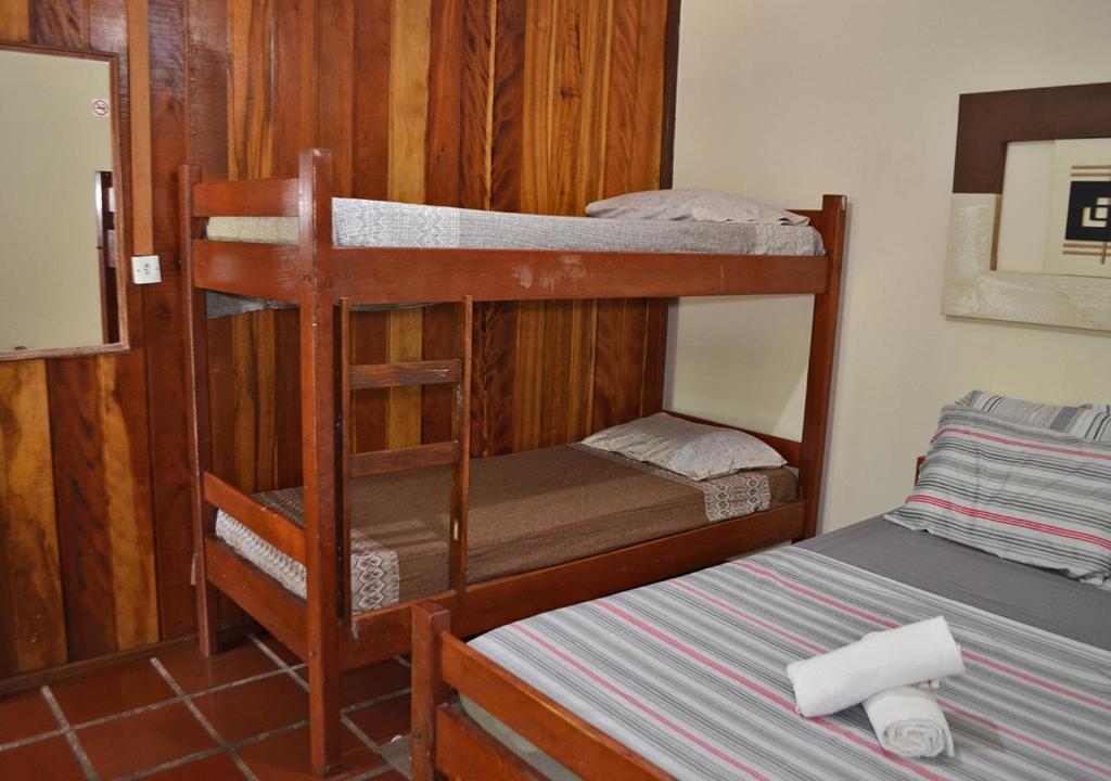Cama ou camas em um quarto em Pousada Renascer