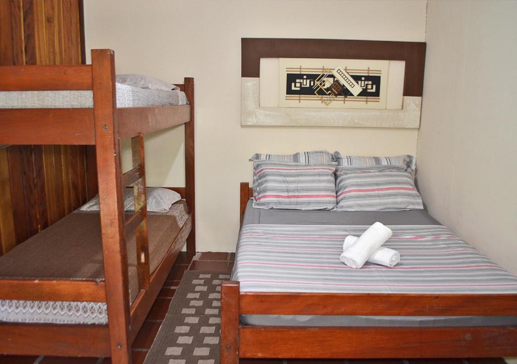 Cama ou camas em um quarto em Pousada Renascer