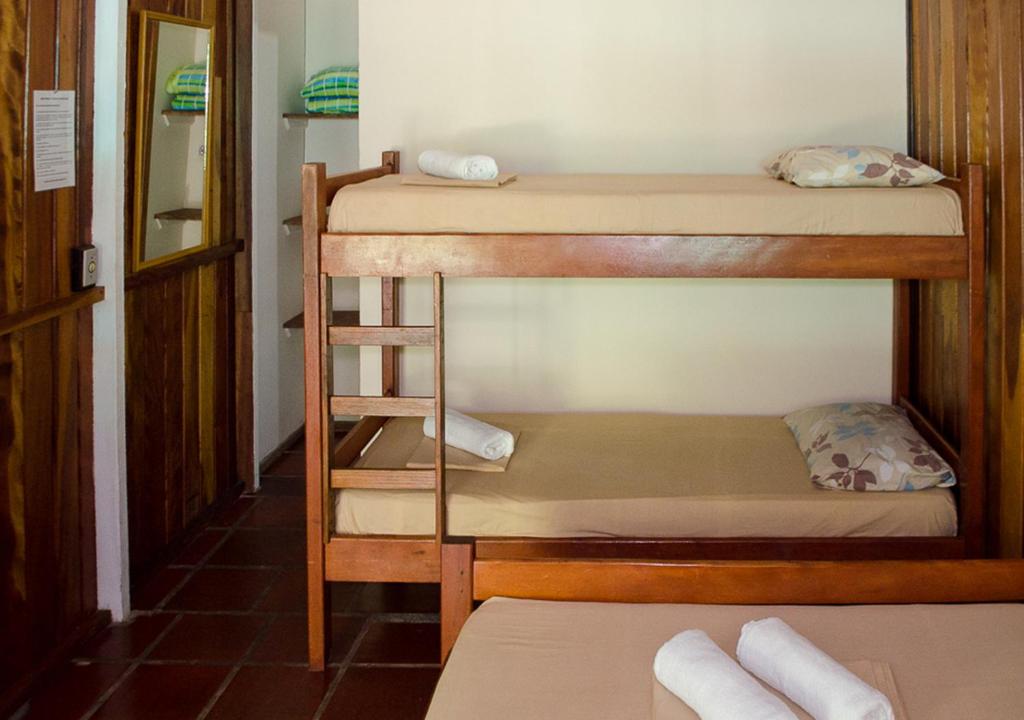 Cama ou camas em um quarto em Pousada Renascer
