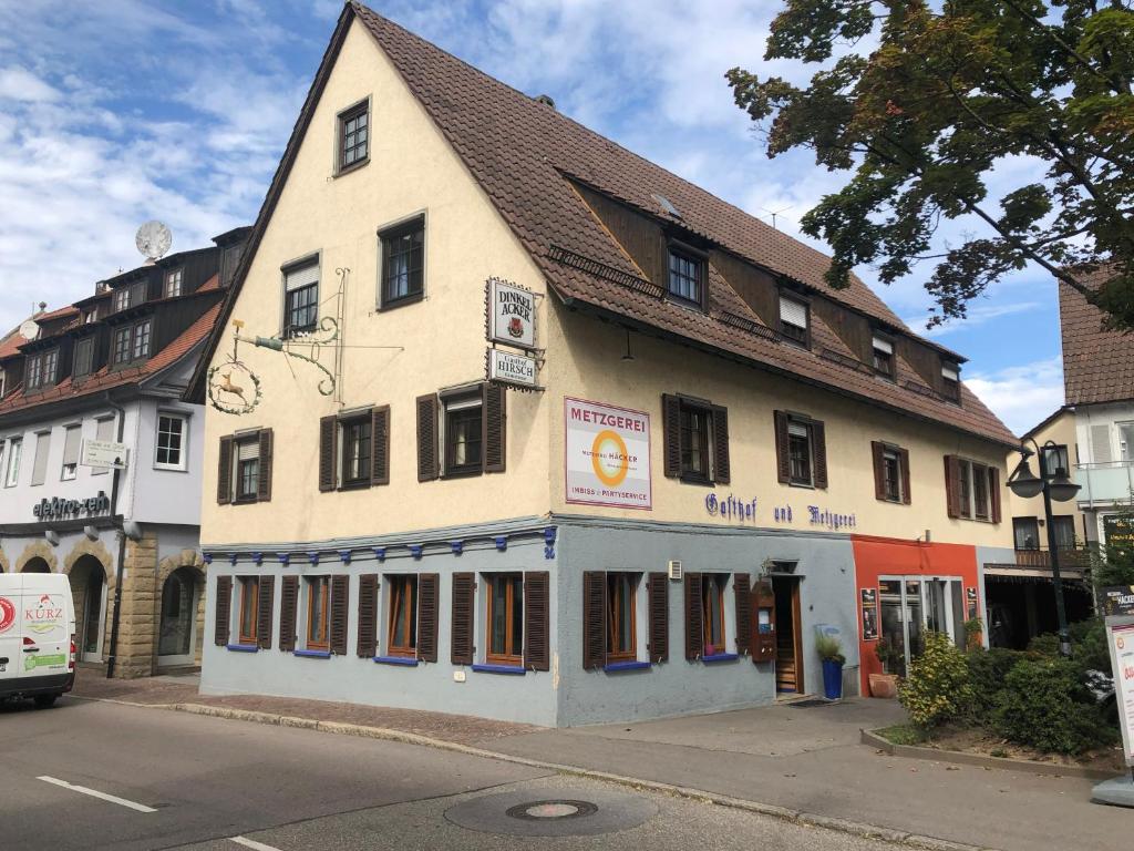 a building on the corner of a street at Gasthof zum Hirsch in Sachsenheim