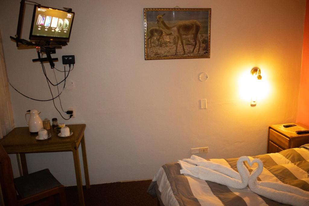 Postel nebo postele na pokoji v ubytování Pacha Suite