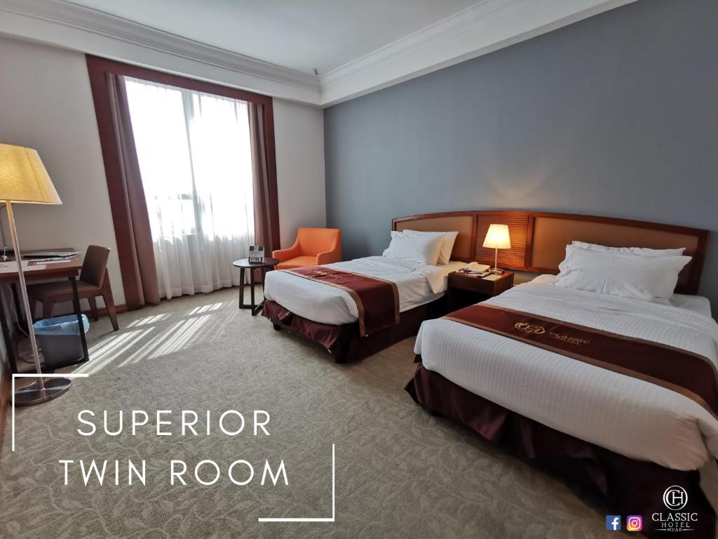 Postel nebo postele na pokoji v ubytování Classic Hotel