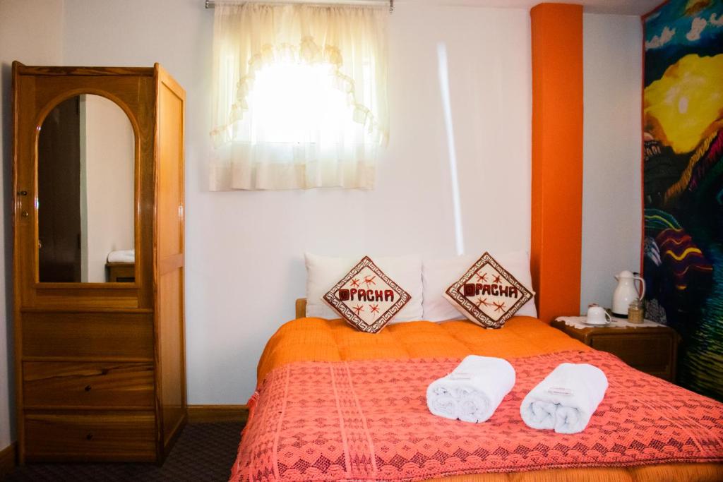 Postel nebo postele na pokoji v ubytování Pacha Suite