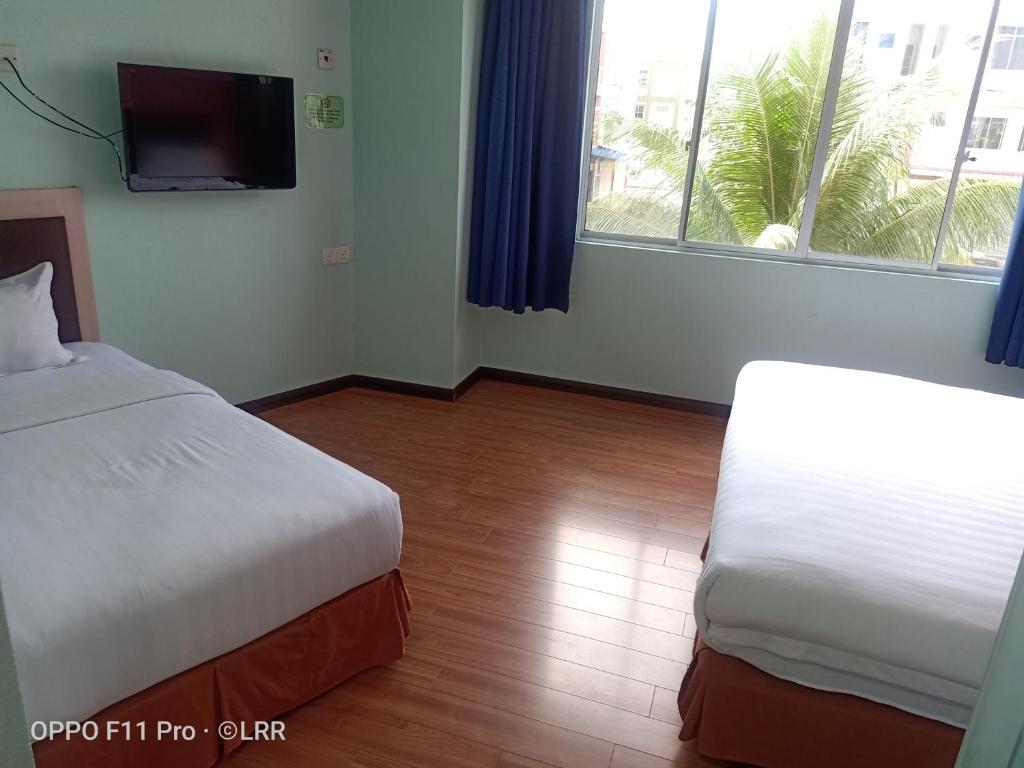 Postel nebo postele na pokoji v ubytování Salim Inn