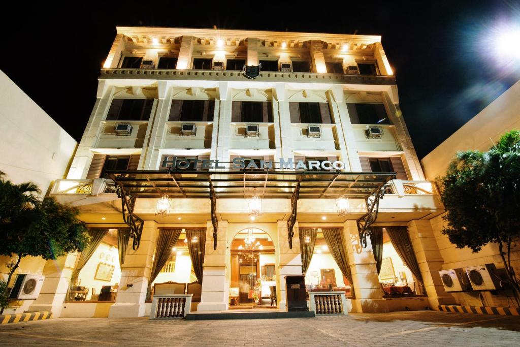 a building with a sign on the front of it at Hotel San Marco in General Santos