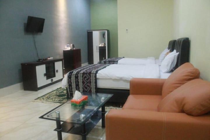 Postel nebo postele na pokoji v ubytování GLOBAL VIEW HOTEL