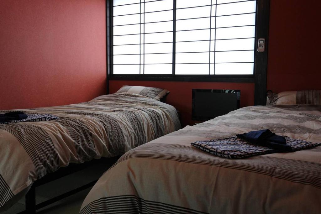 Letto o letti in una camera di 小さなお宿 乃むら