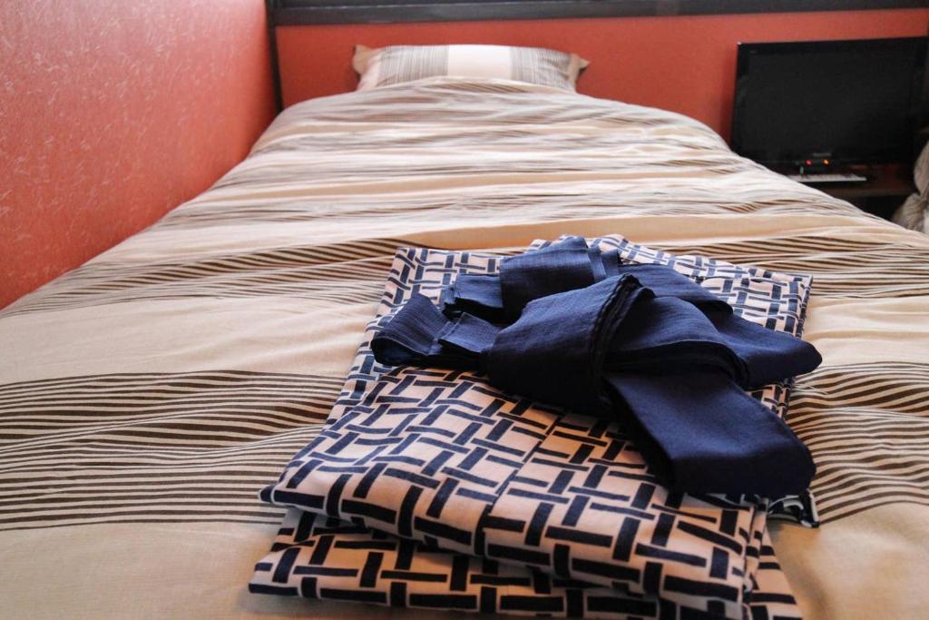 Letto o letti in una camera di 小さなお宿 乃むら