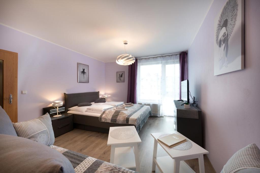 Postel nebo postele na pokoji v ubytování B2B Apartments