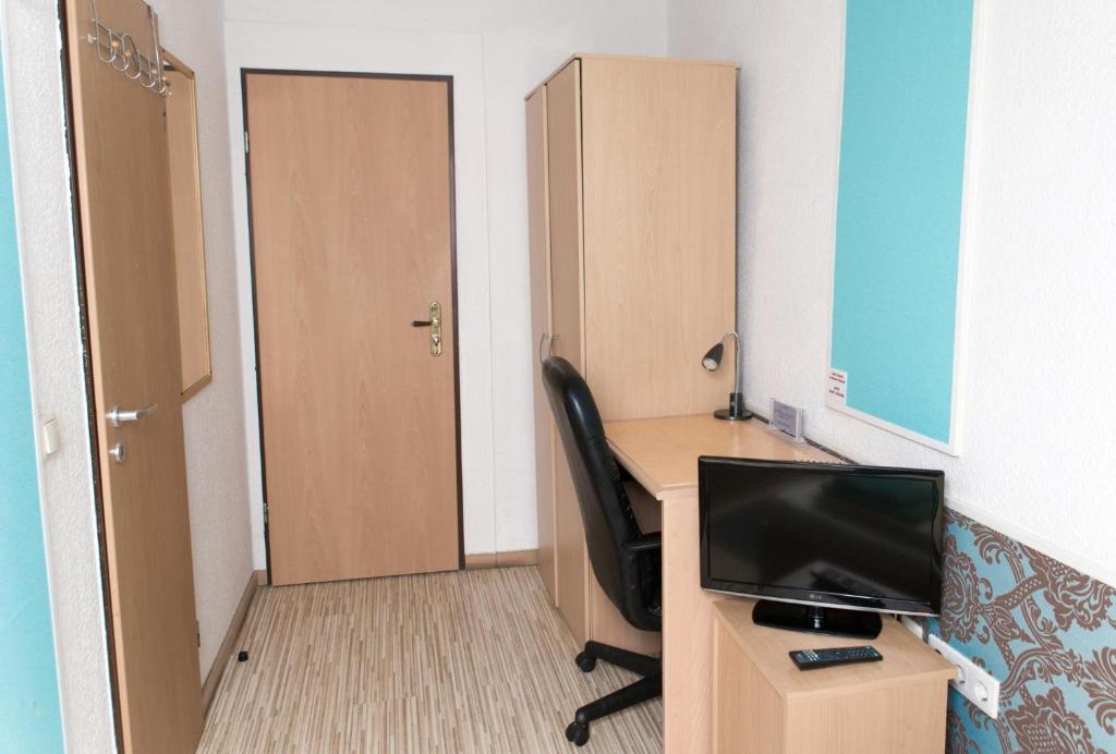 TV a/nebo společenská místnost v ubytování Pension Central Nuernberg-Fuerth