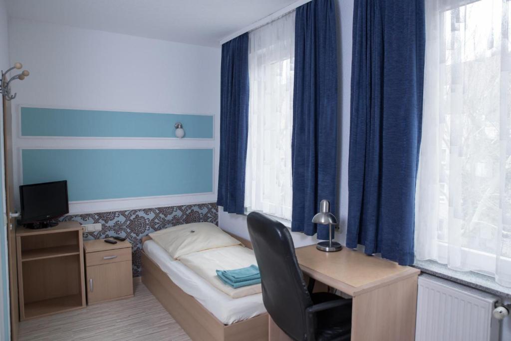 TV a/nebo společenská místnost v ubytování Pension Central Nuernberg-Fuerth