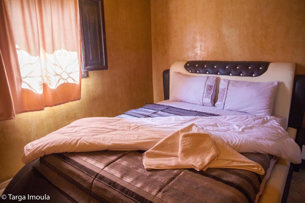 Postel nebo postele na pokoji v ubytování Targa Imoula