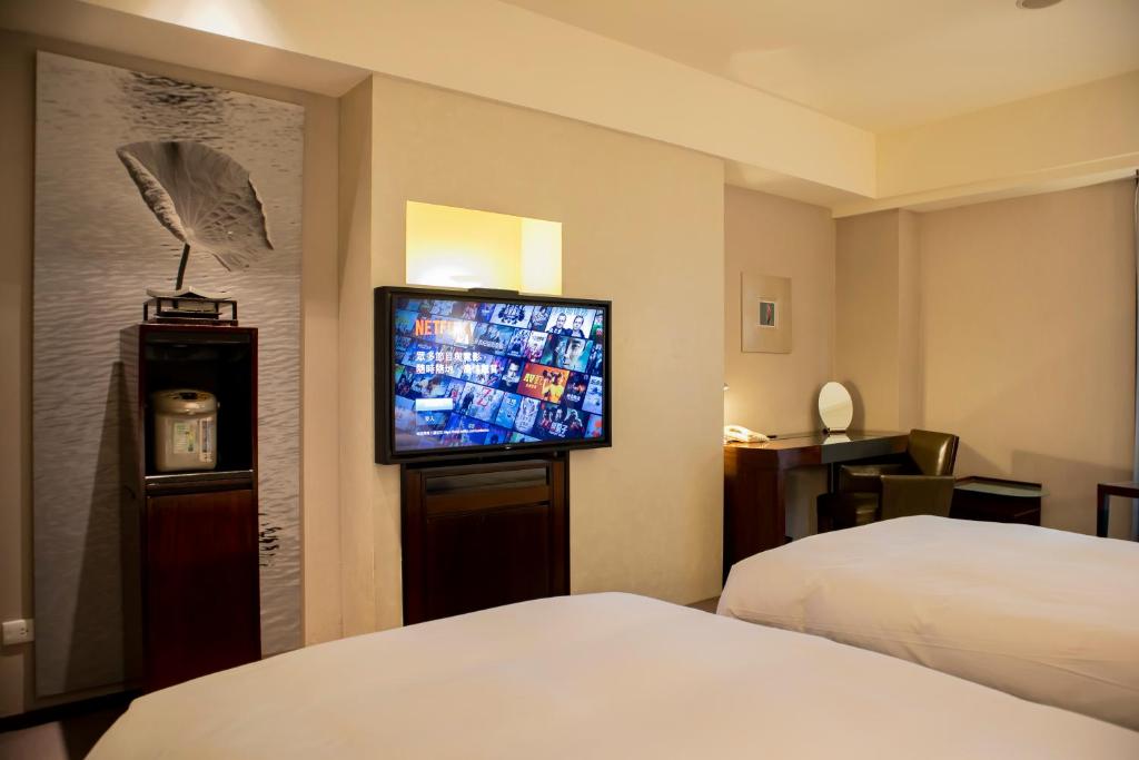 Postel nebo postele na pokoji v ubytování Les Suites Taipei - Da An