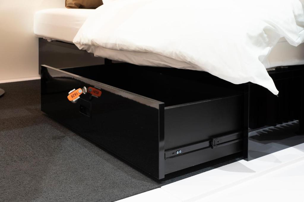 Postel nebo postele na pokoji v ubytování FIRSTCABIN Kyoto Nijojo