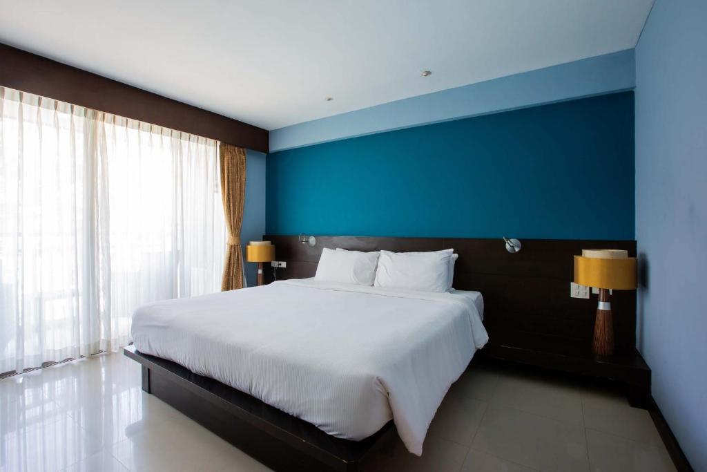 Postel nebo postele na pokoji v ubytování Blue Tara Hotel Krabi Ao Nang