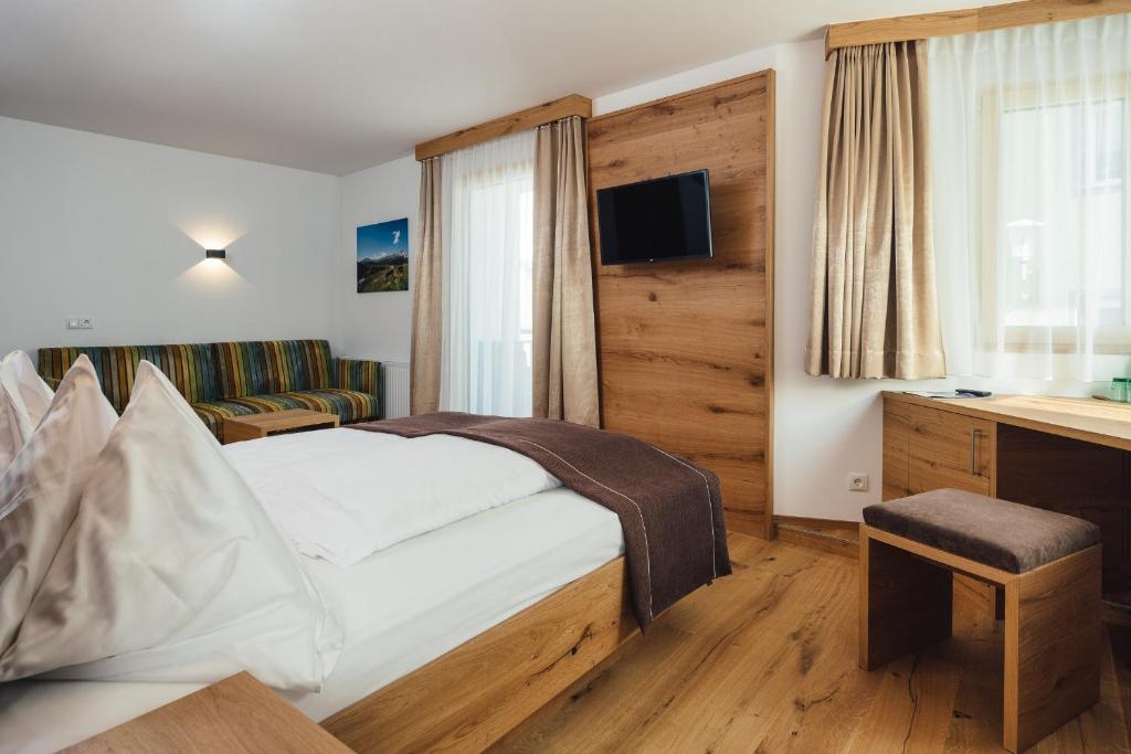 Postel nebo postele na pokoji v ubytování Hotel Post