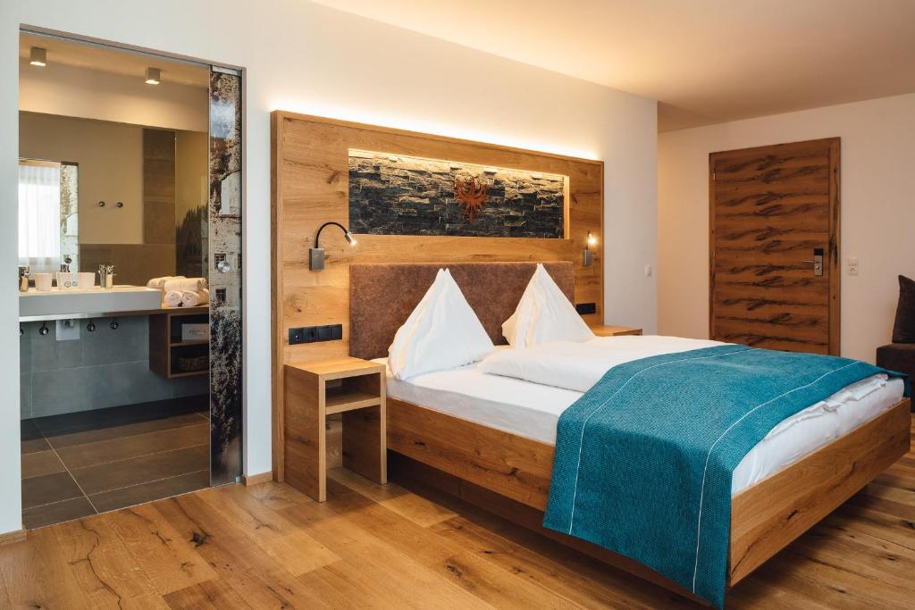 Postel nebo postele na pokoji v ubytování Hotel Post